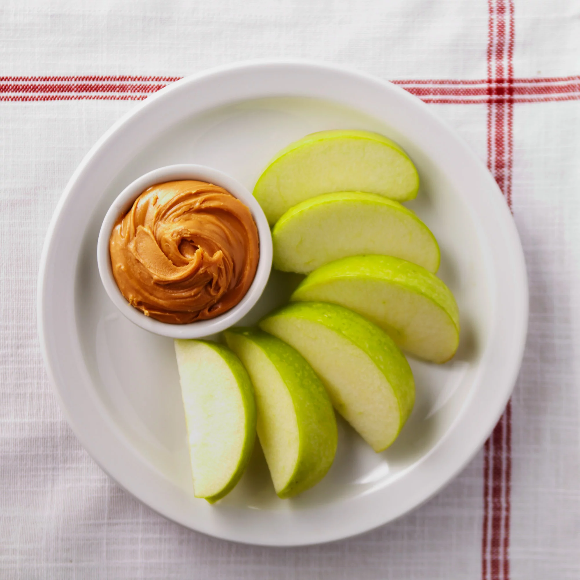 Slices of Apple with Peanut Butter.